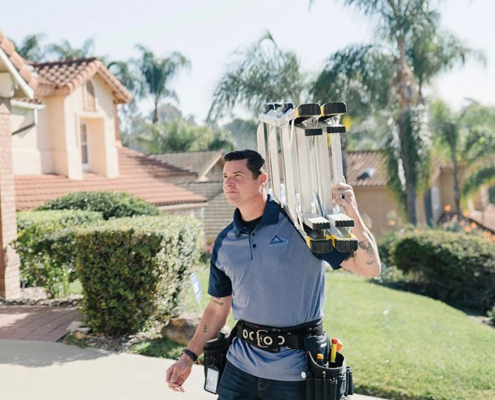 Brandon Spurgeon carrying ladder